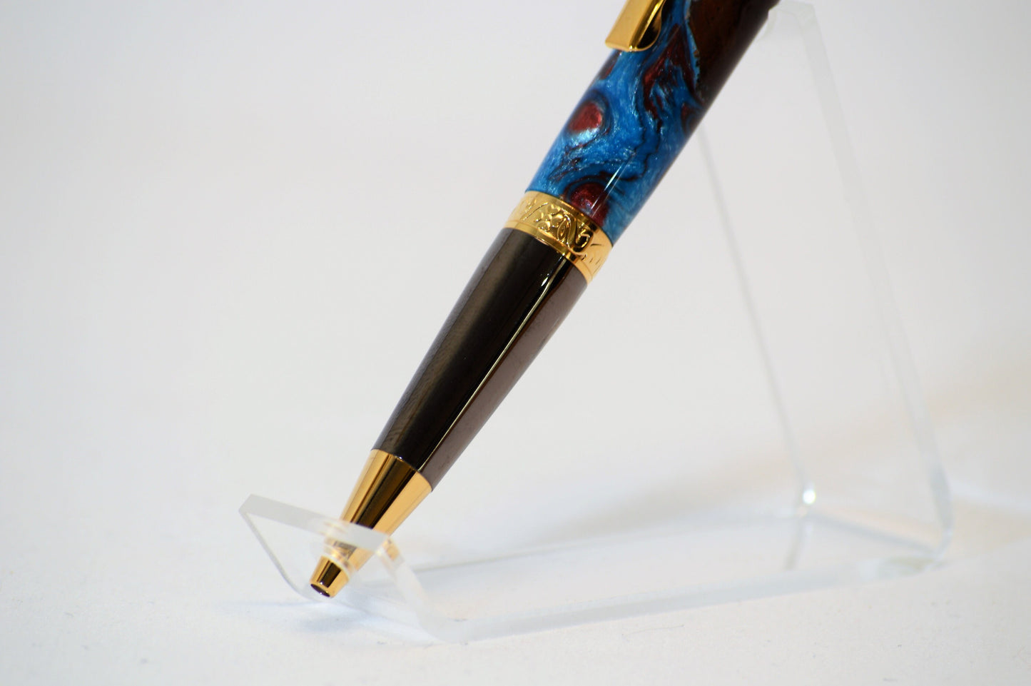 One of a Kind Elegant Twist Pen in Gold Titanium and Black Titanium with Handcrafted Acrylic and North Georgia Walnut Body.