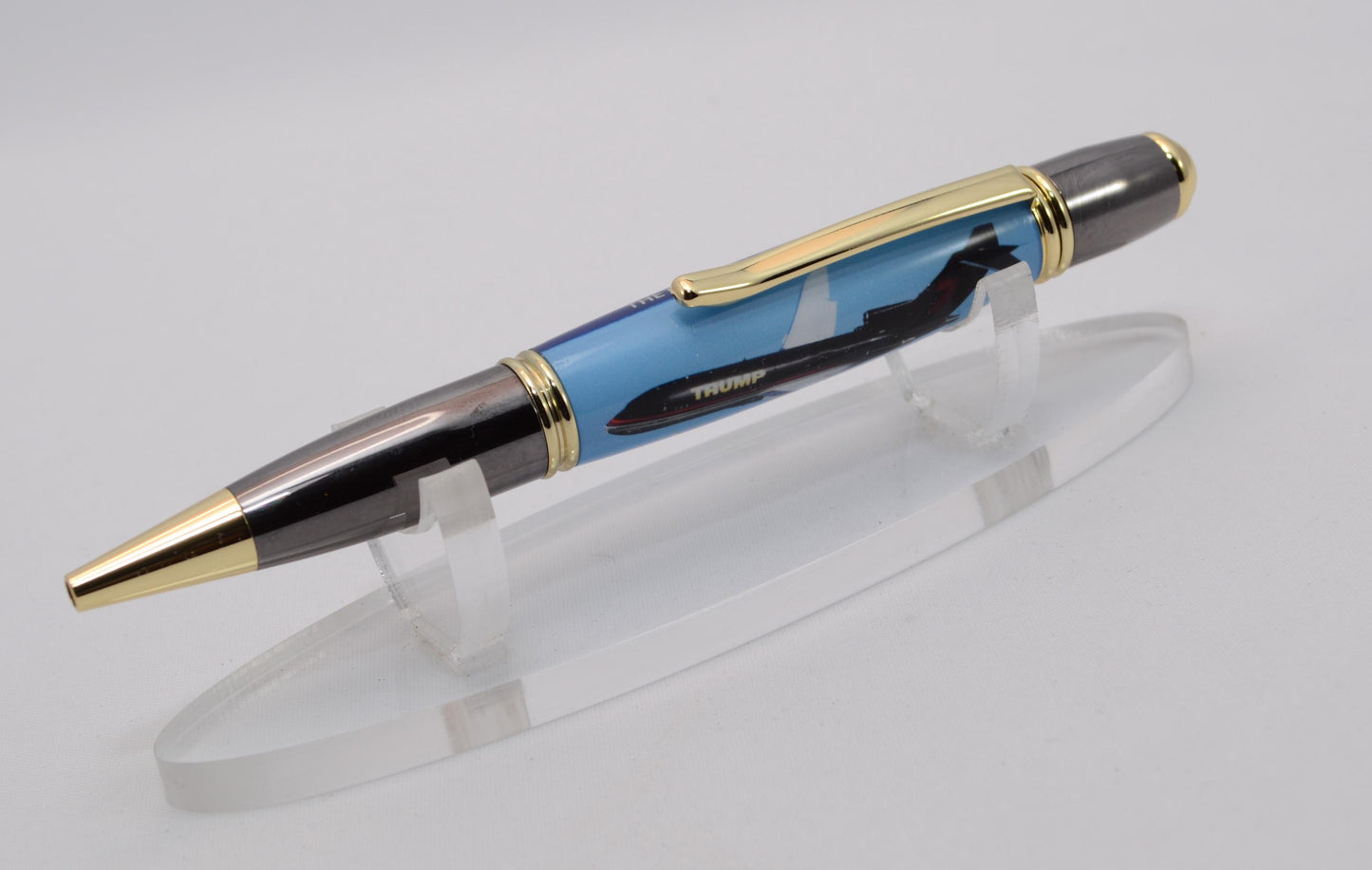 Handcrafted Pen made with a small piece of metal from Donald Trump's Boeing 727 Known as Trump Force One and cast in acrylic.