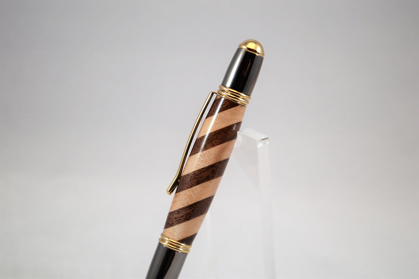 One of a Kind Classic Twist Pen in 22k Gold and Gunmetal Finish with Handcrafted Maple and Walnut.