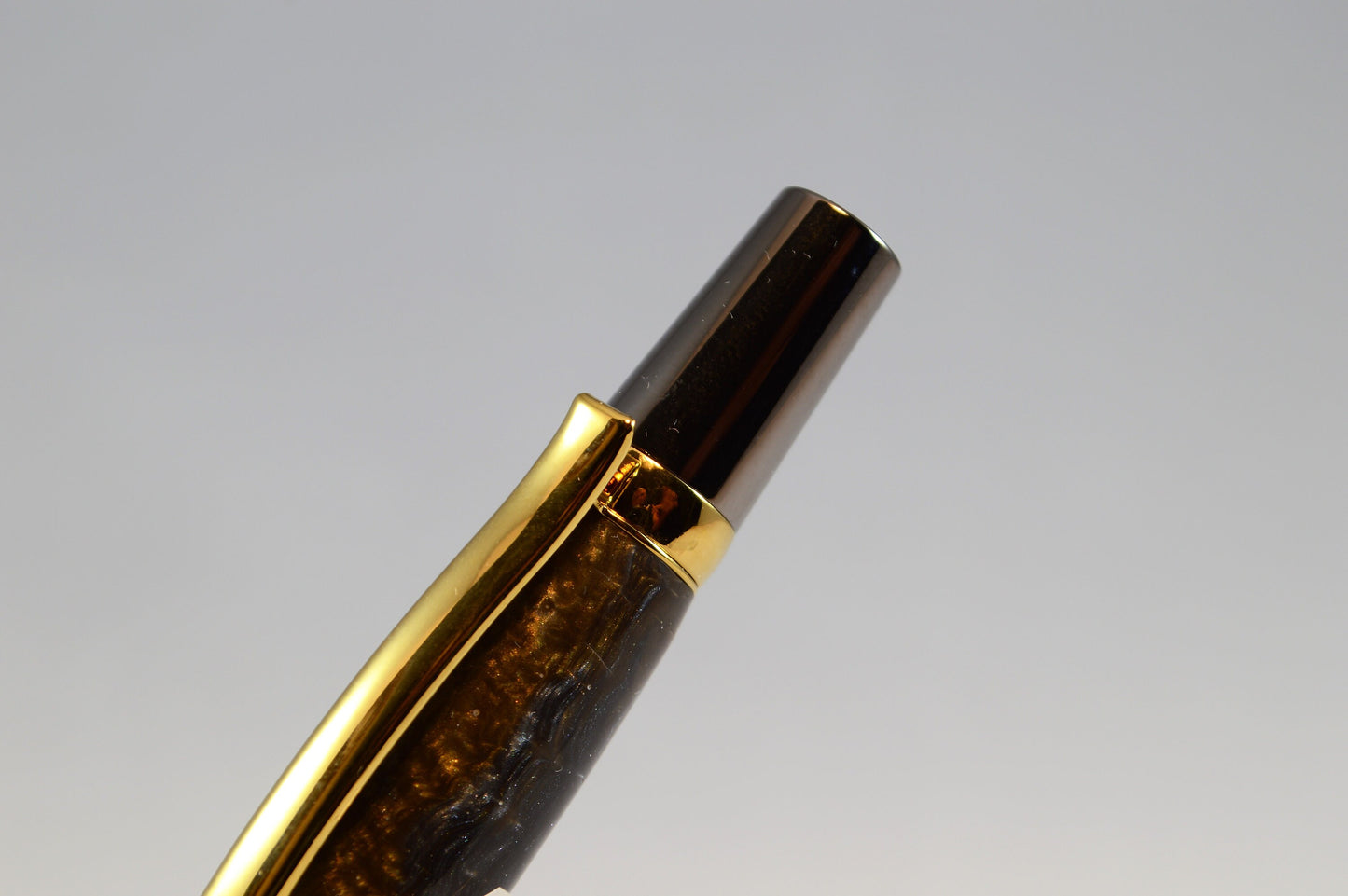 One of a Kind Twist Pen in Gold Titanium and Black Titanium with Handcrafted Acrylic Body.