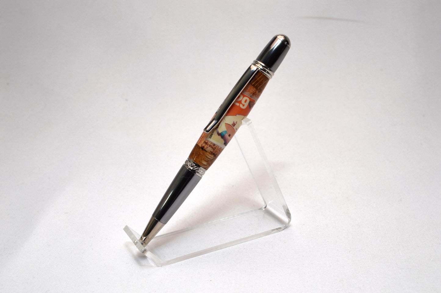 Handcrafted Pen Featuring a Hank Williams Postage Stamp and Wood from Hank Williams Bosier City, LA home cast in acrylic.