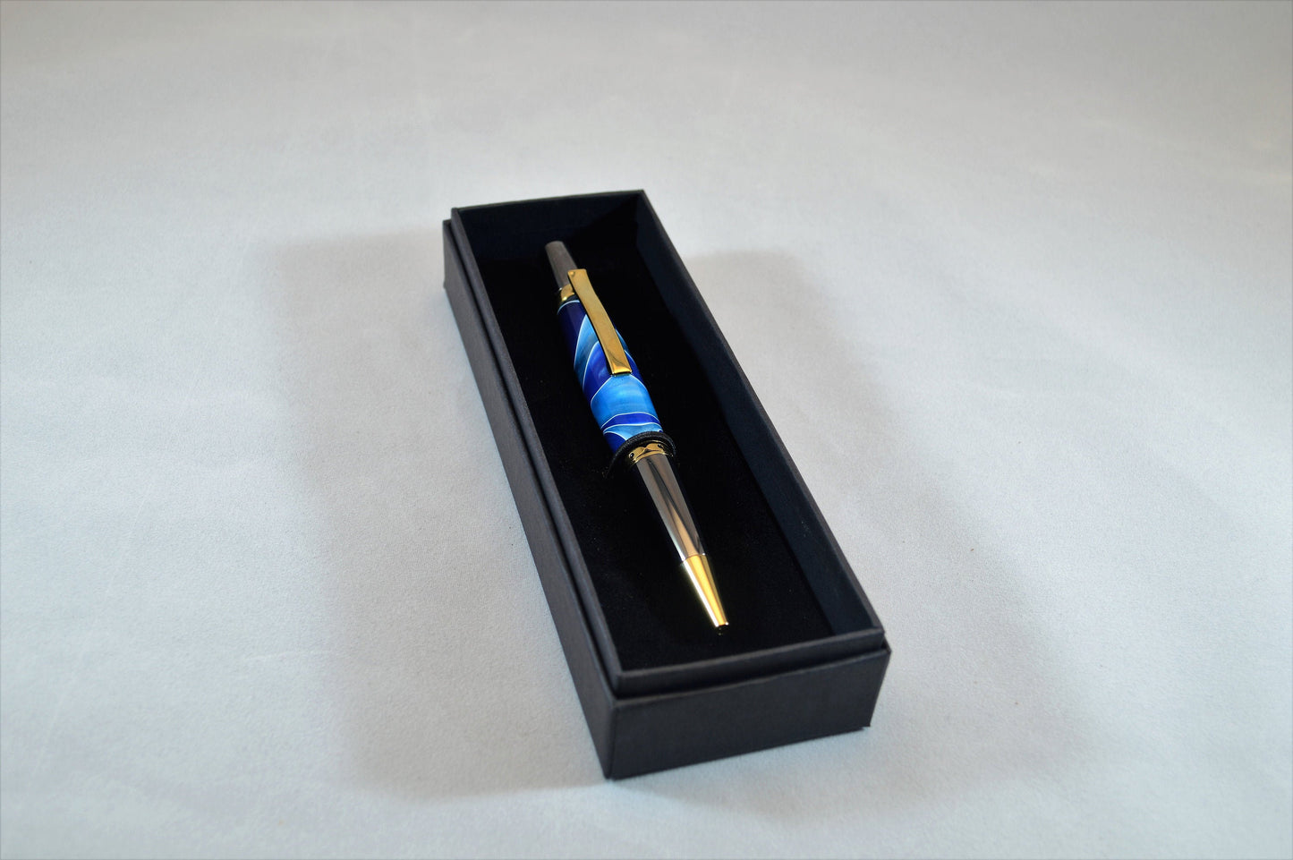 One of a Kind Classic Twist Pen in Gold Titanium and Black Titanium with Handcrafted Acrylic Body.