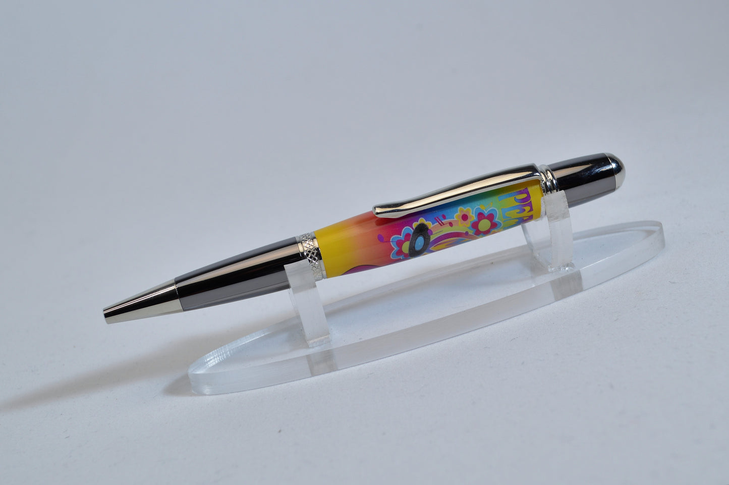 Handcrafted Pen Featuring a Small Piece of Woodstock Stage Wood and Cast in Acrylic.
