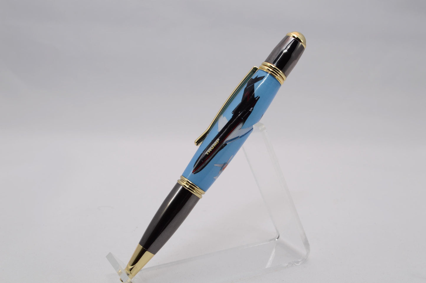 Handcrafted Pen made with a small piece of metal from Donald Trump's Boeing 727 Known as Trump Force One and cast in acrylic.