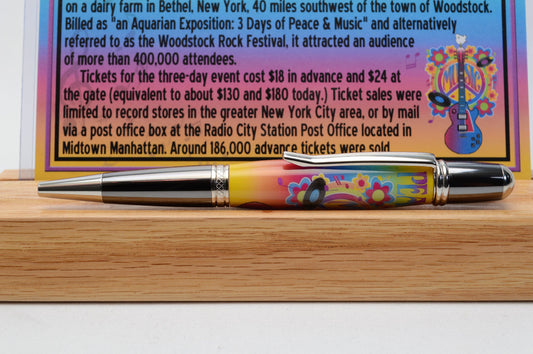 Handcrafted Pen Featuring a Small Piece of Woodstock Stage Wood and Cast in Acrylic.
