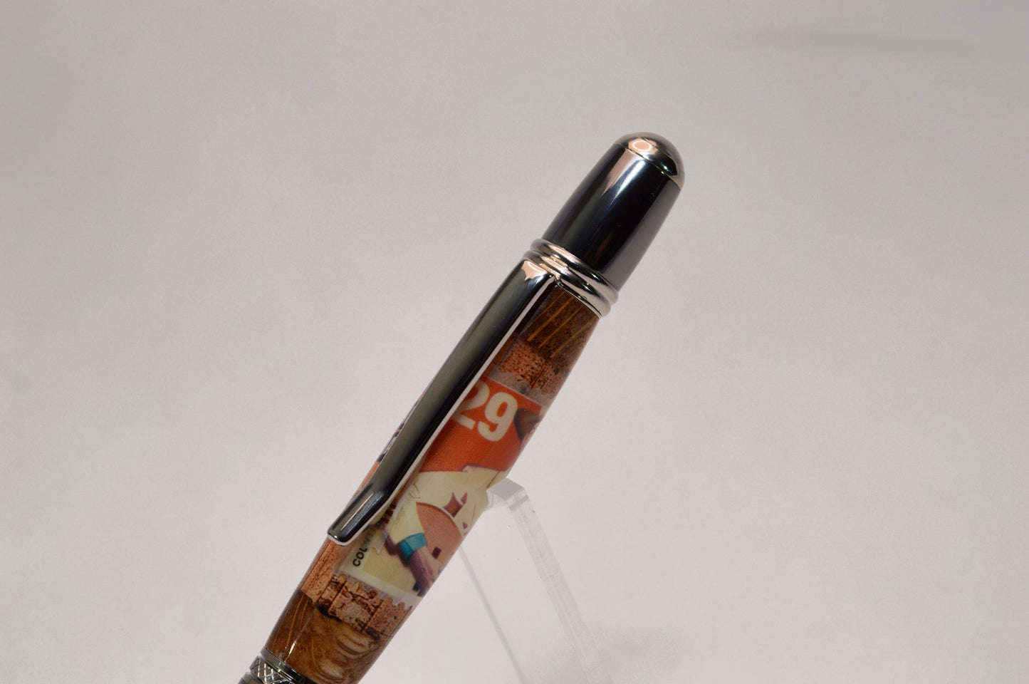 Handcrafted Pen Featuring a Hank Williams Postage Stamp and Wood from Hank Williams Bosier City, LA home cast in acrylic.