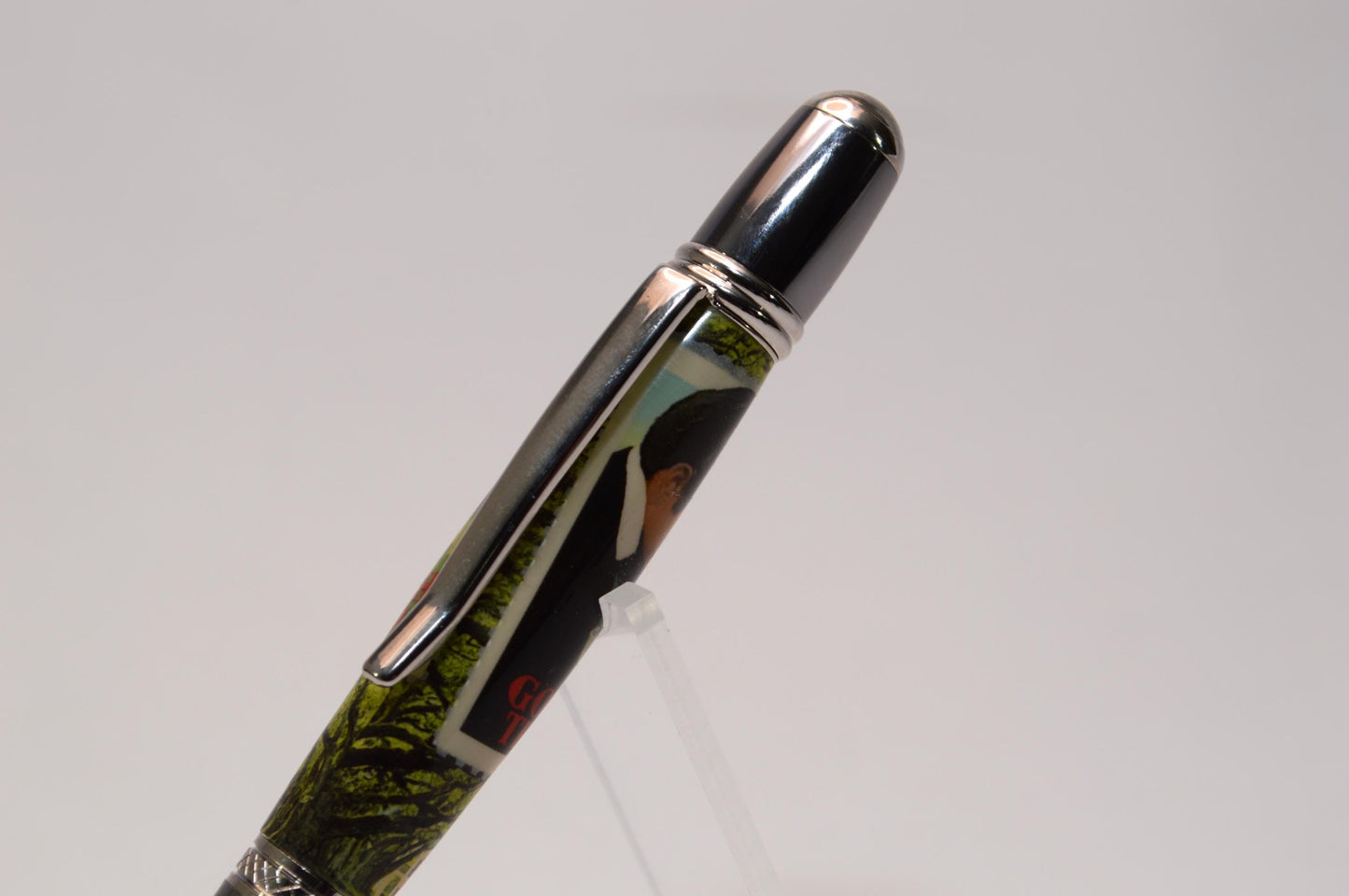 Handcrafted Pen Featuring Gone With The Wind Postage Stamp and Small Piece of Wood From Margaret Mitchell's apartment and cast in acrylic.