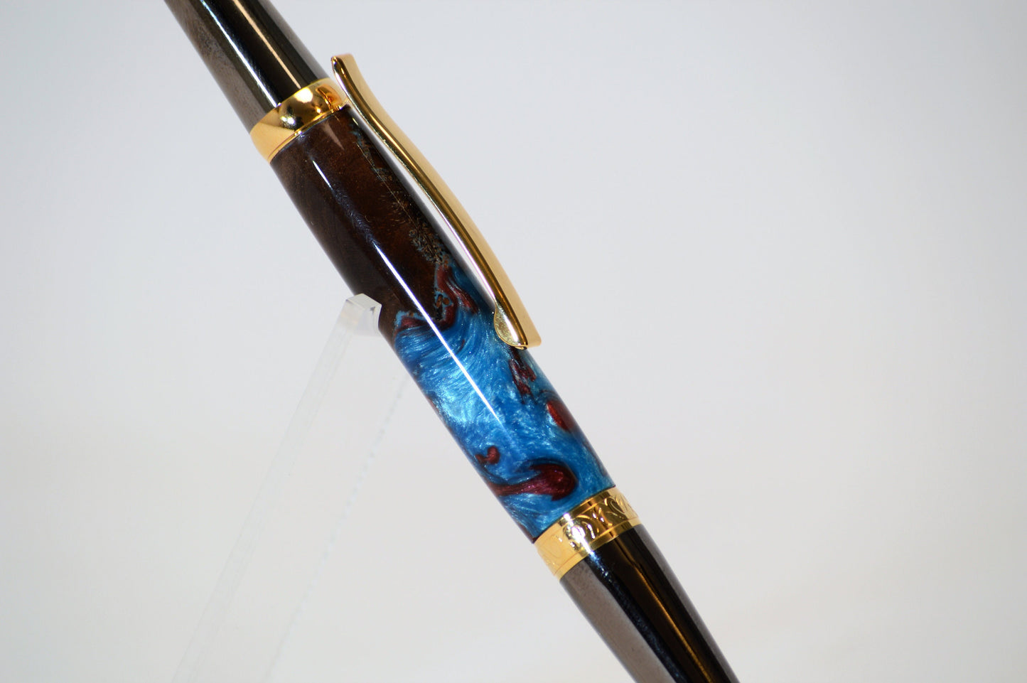 One of a Kind Elegant Twist Pen in Gold Titanium and Black Titanium with Handcrafted Acrylic and North Georgia Walnut Body.