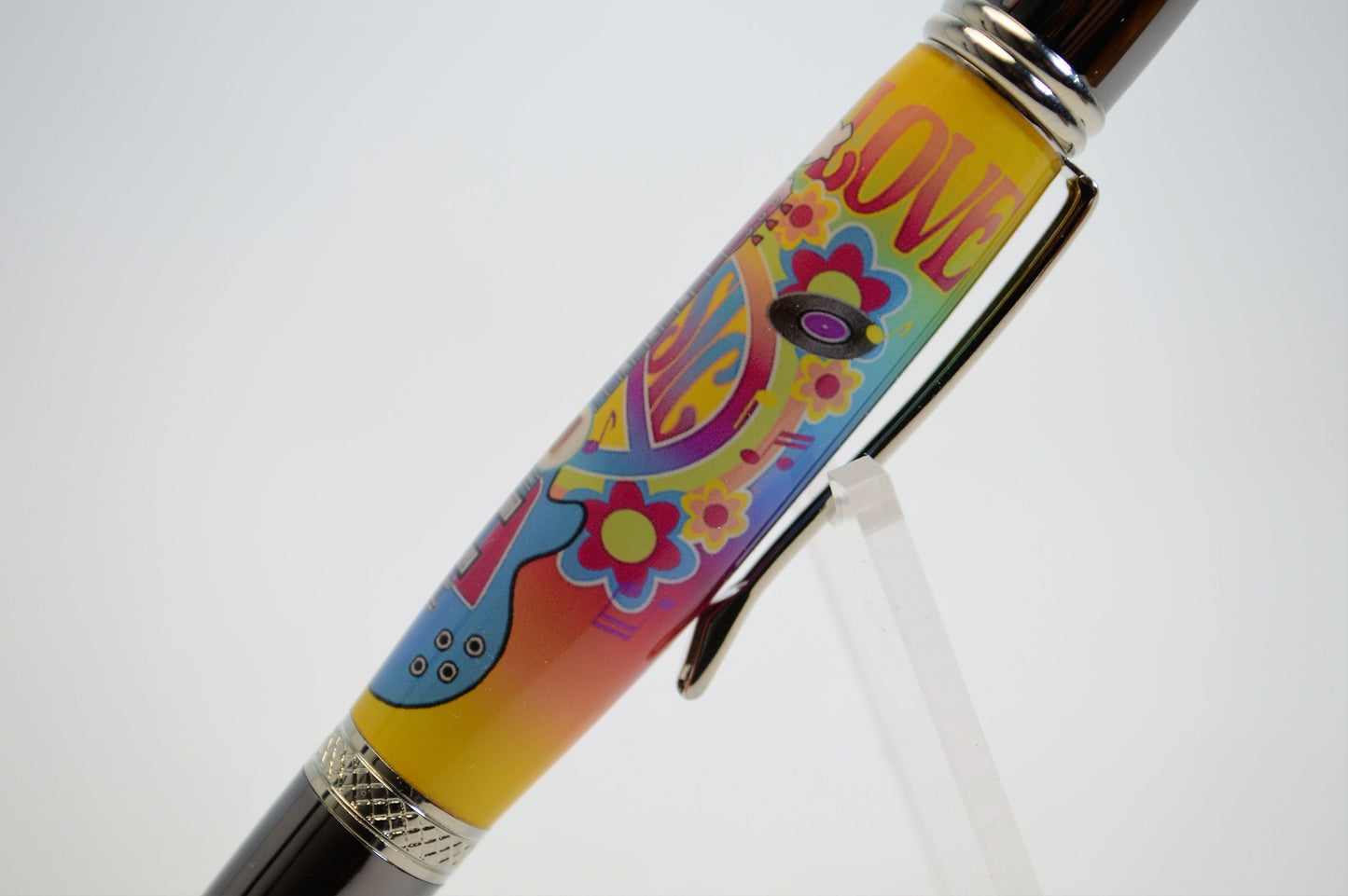 Handcrafted Pen Featuring a Small Piece of Woodstock Stage Wood and Cast in Acrylic.