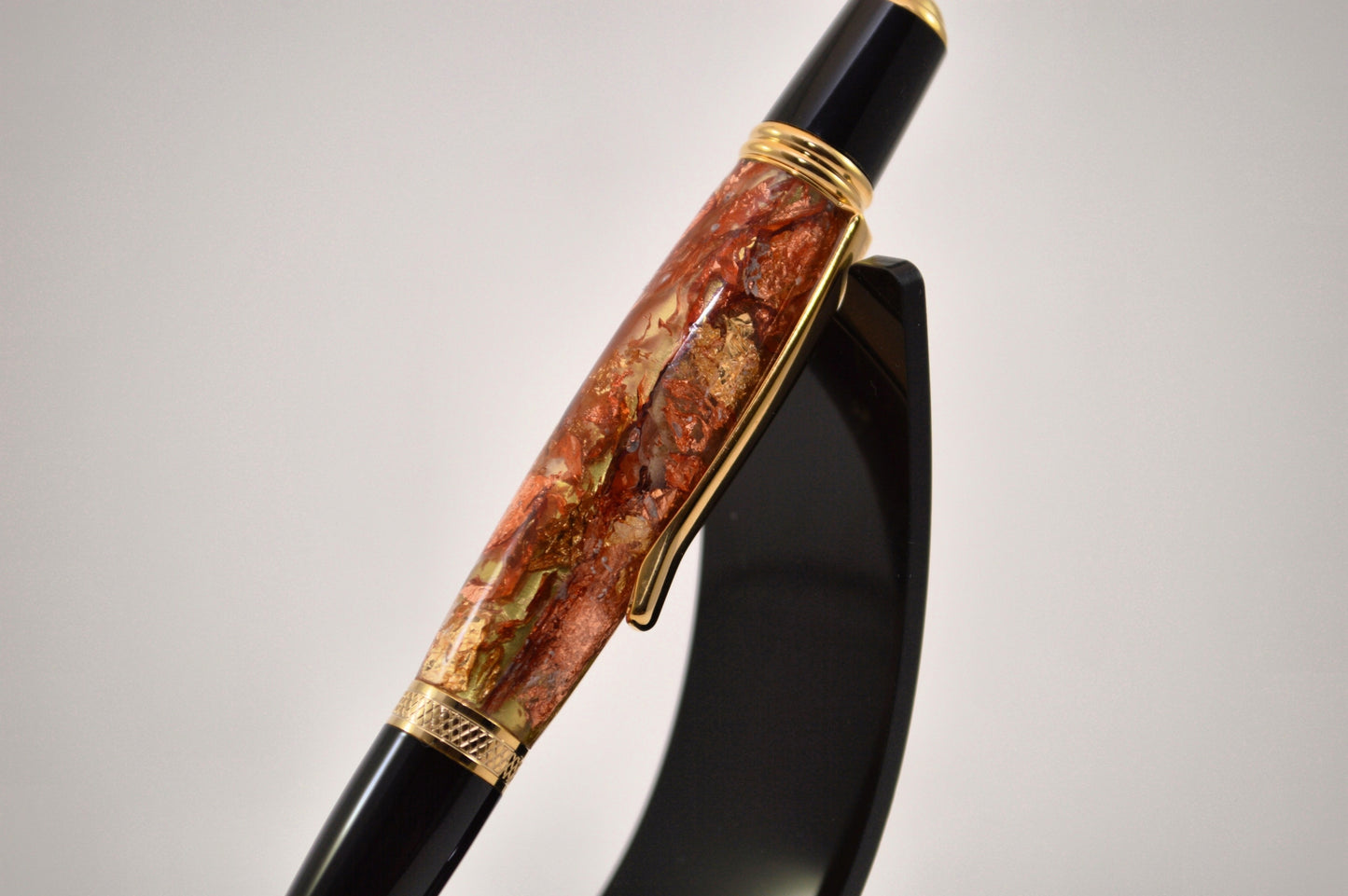 Elegant Gold and Black Chrome Twist Pen with Copper And Gold Gilding Cast in Clear Acrylic