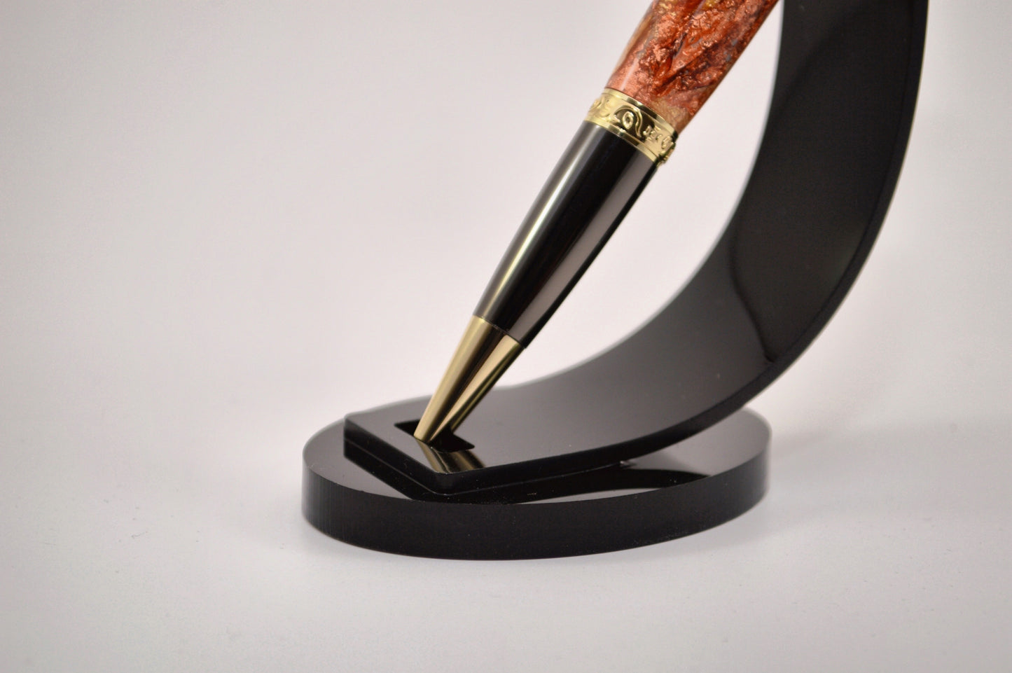 Elegant Gold and Gunmetal Twist Pen with Copper And Gold Gilding Cast in Clear Acrylic