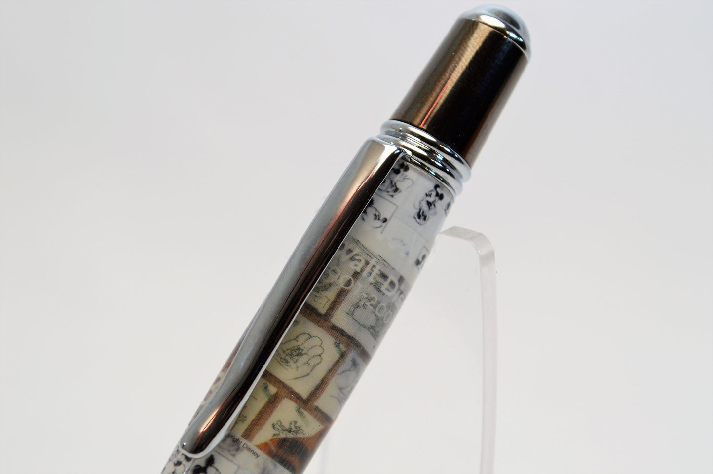 Handcrafted Pen Featuring a Walt Disney Stamp and Small Piece of Wood From Walt Disney's first garage studio in Hollywood, CA.