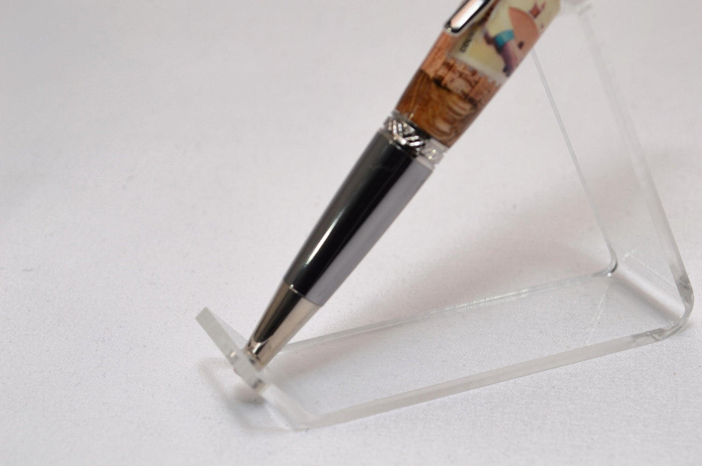 Handcrafted Pen Featuring a Hank Williams Postage Stamp and Wood from Hank Williams Bosier City, LA home cast in acrylic.