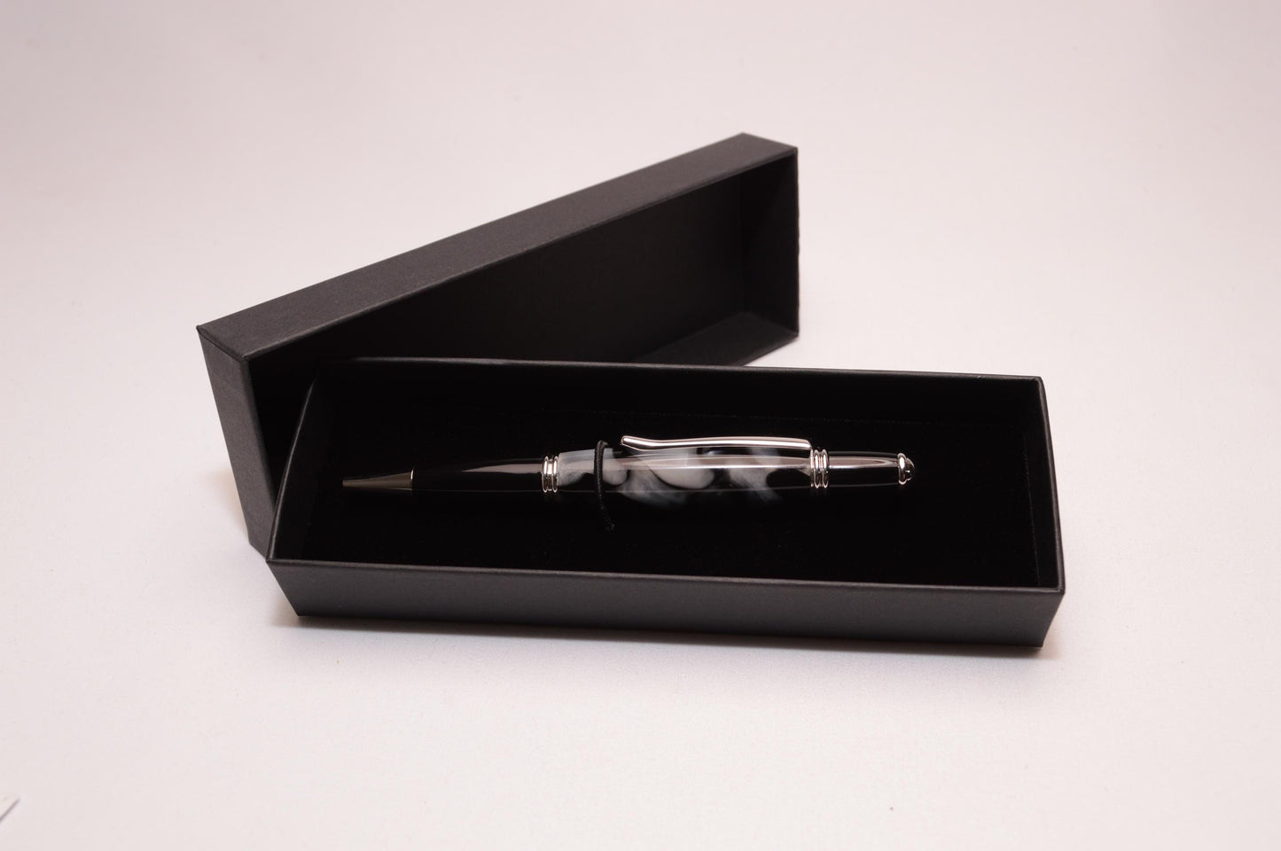 Elegant Handcrafted Twist Pen in Striking Black and White Acrylic with Rhodium and Black Chrome Finish