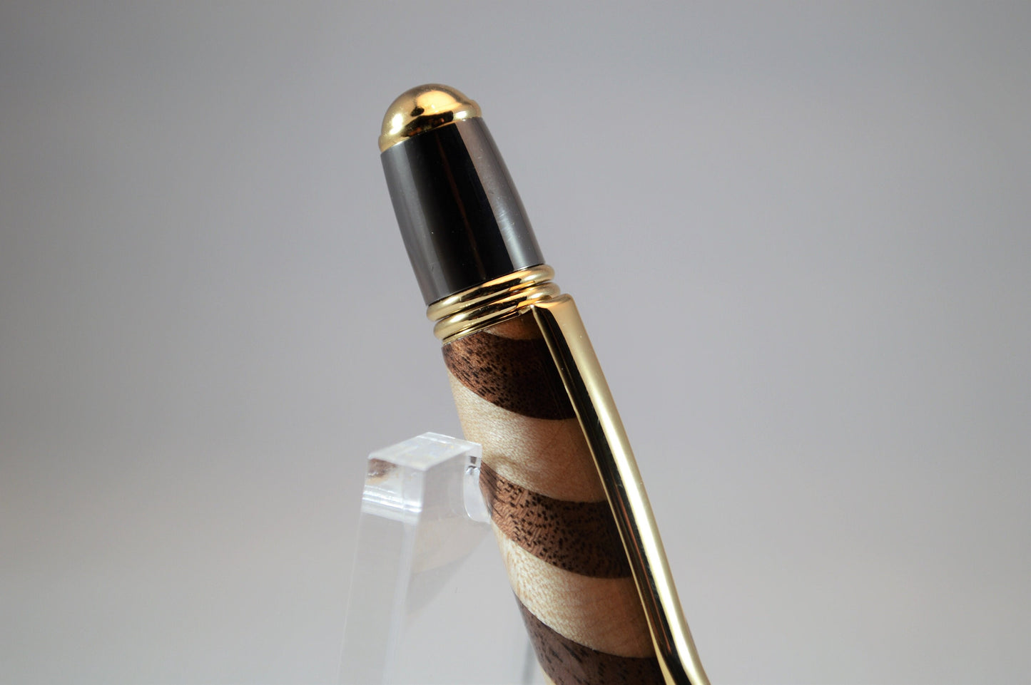 One of a Kind Classic Twist Pen in 22k Gold and Gunmetal Finish with Handcrafted Maple and Walnut.
