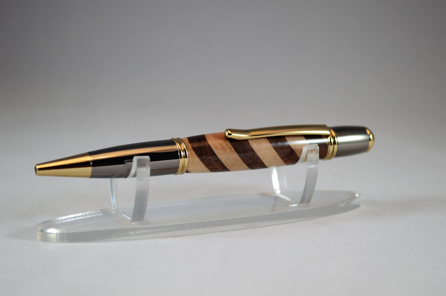 One of a Kind Classic Twist Pen in 22k Gold and Gunmetal Finish with Handcrafted Maple and Walnut.