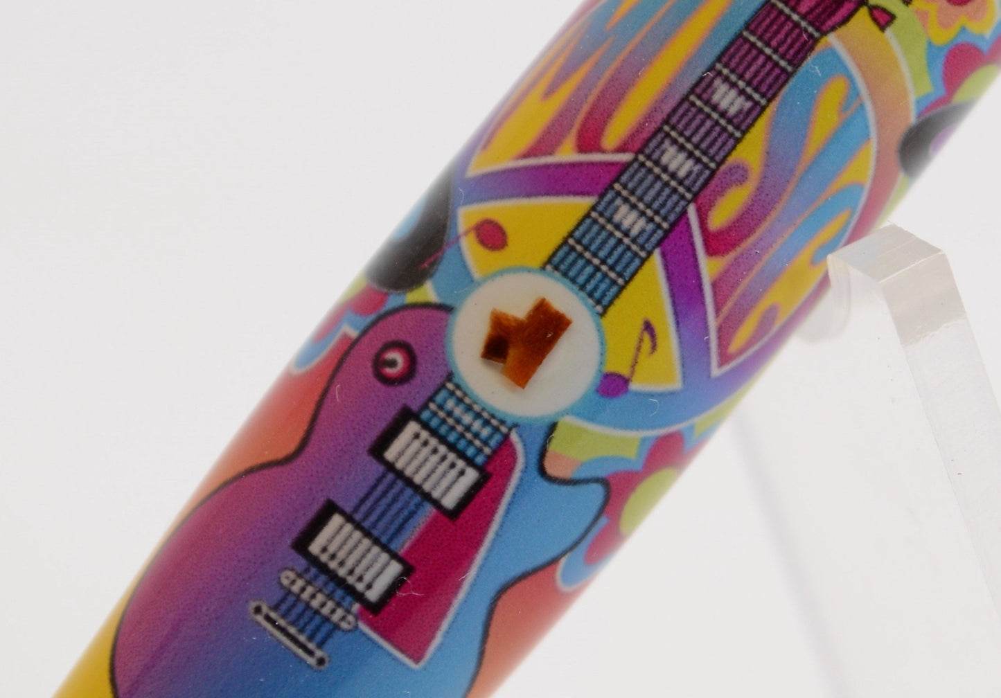 Handcrafted Pen Featuring a Small Piece of Woodstock Stage Wood and Cast in Acrylic.