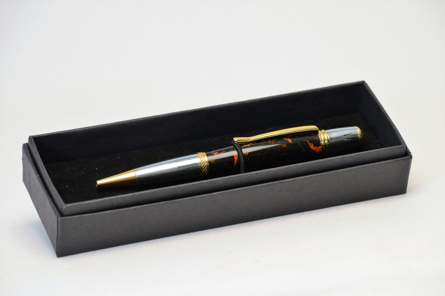 One of a Kind Classic Twist Pen in Gold Titanium and Chrome with Handcrafted Black and Orange Acrylic Body