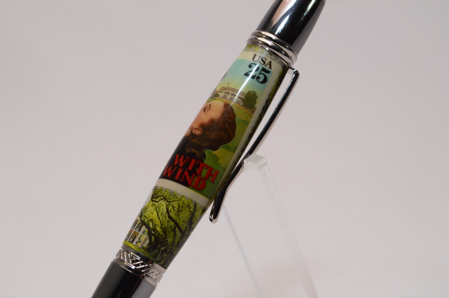 Handcrafted Pen Featuring Gone With The Wind Postage Stamp and Small Piece of Wood From Margaret Mitchell's apartment and cast in acrylic.