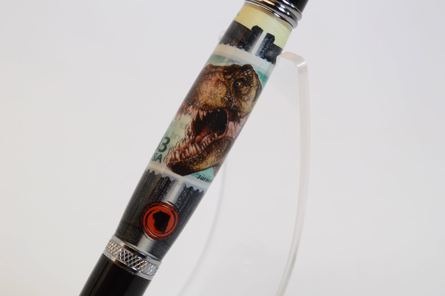 Handcrafted Pen Featuring A Jurassic Park US Postage Stamp & Movie Set Tree Wood Cast in Acrylic