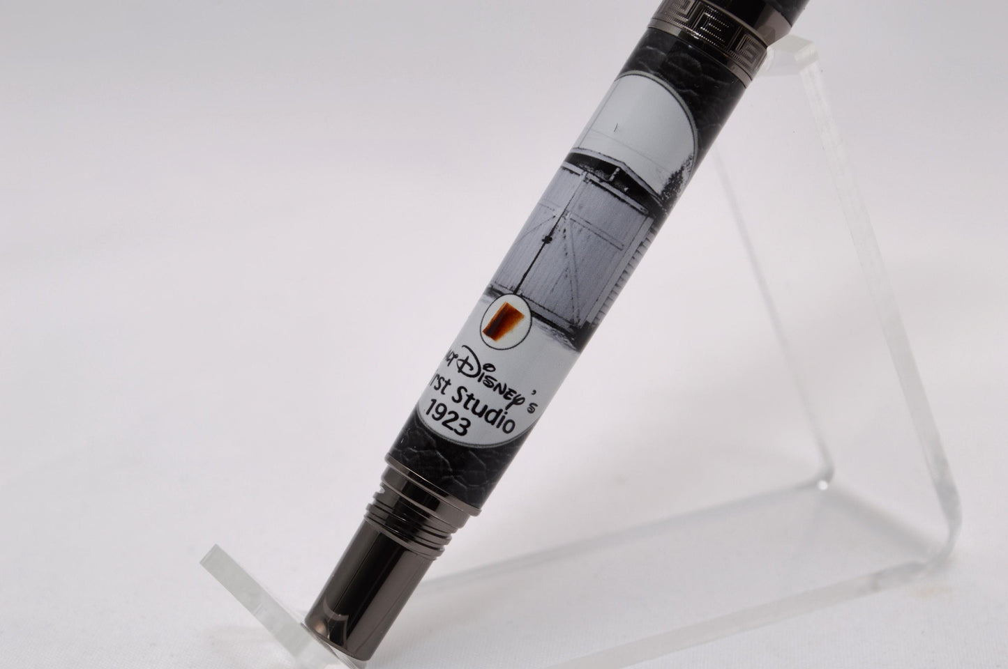 Handcrafted Rollerball Pen Featuring a Small Piece of Wood From Walt Disney's First Garage Studio in Hollywood, CA and Cast in Acrylic.