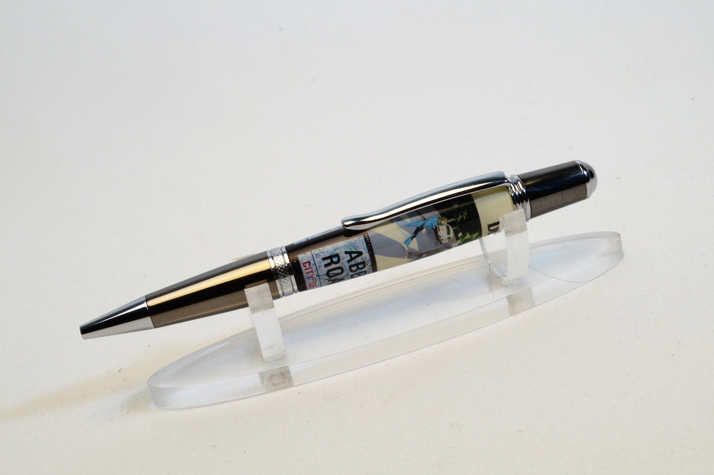 Handcrafted Pen Made with A Small Piece of Wood from Abbey Road Studios and cast in acrylic.