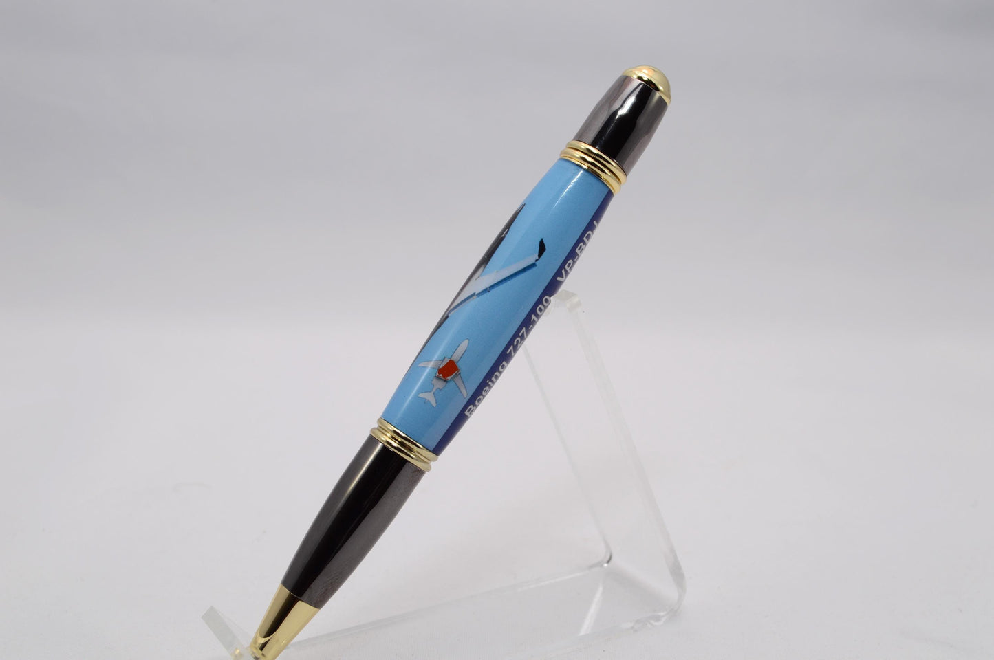 Handcrafted Pen made with a small piece of metal from Donald Trump's Boeing 727 Known as Trump Force One and cast in acrylic.