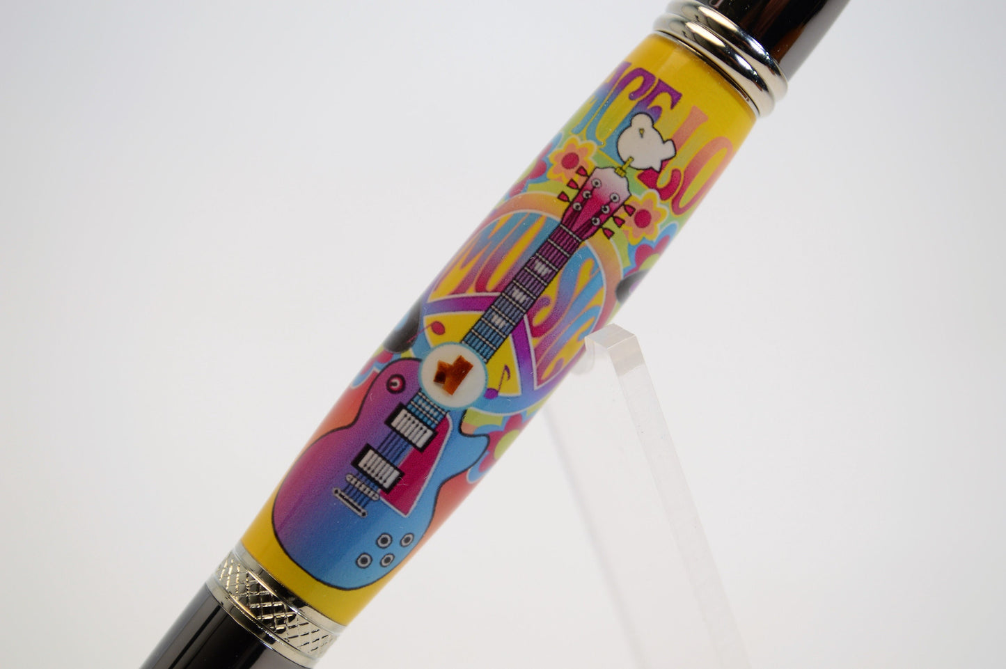 Handcrafted Pen Featuring a Small Piece of Woodstock Stage Wood and Cast in Acrylic.