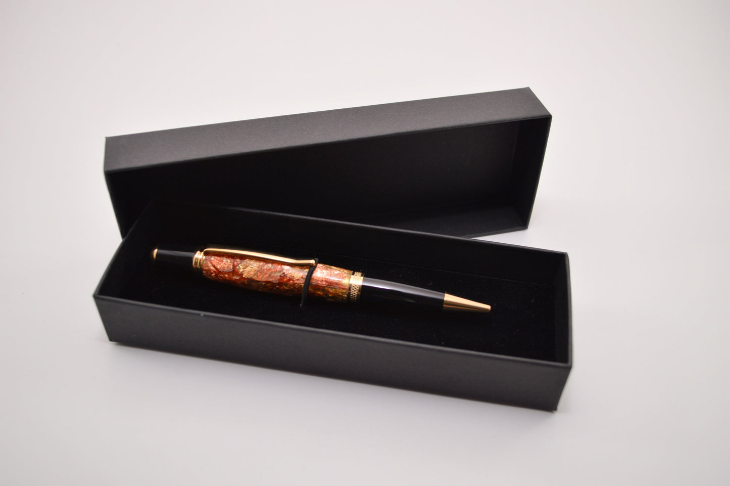Elegant Gold and Black Chrome Twist Pen with Copper And Gold Gilding Cast in Clear Acrylic