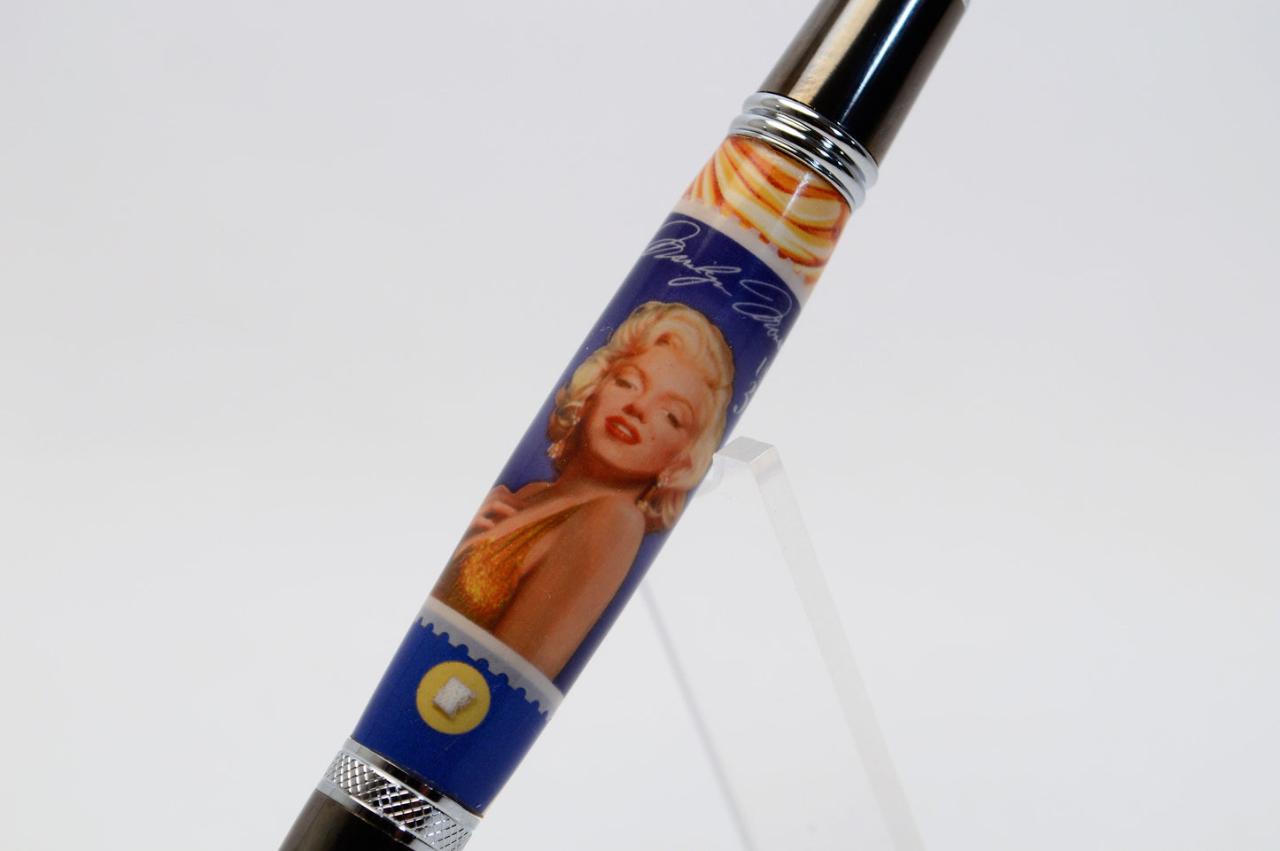 Handcrafted Pen Featuring a Marilyn Monroe US Stamp and a Small Swatch of One of Marilyn Monroe's White Gloves Cast In Acrylic