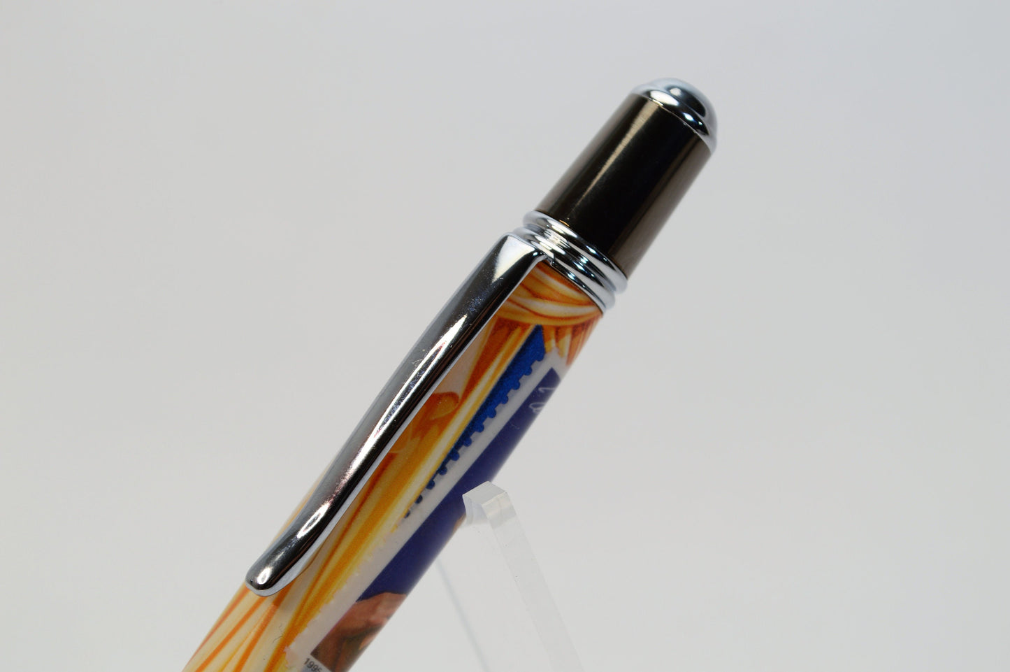 Handcrafted Pen Featuring a Marilyn Monroe US Stamp and a Small Swatch of One of Marilyn Monroe's White Gloves Cast In Acrylic