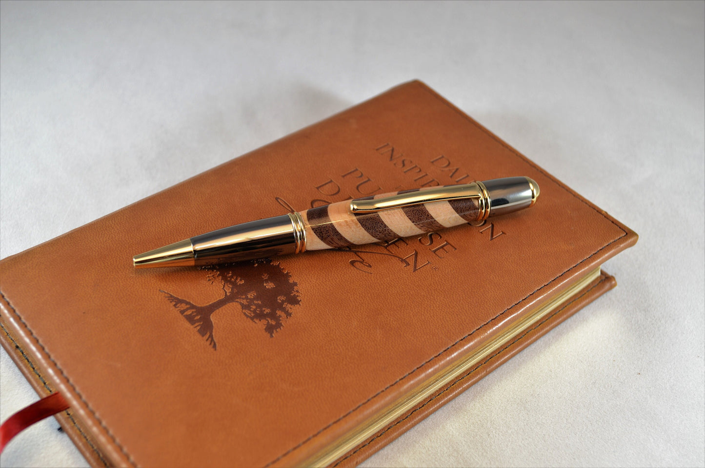 One of a Kind Classic Twist Pen in 22k Gold and Gunmetal Finish with Handcrafted Maple and Walnut.