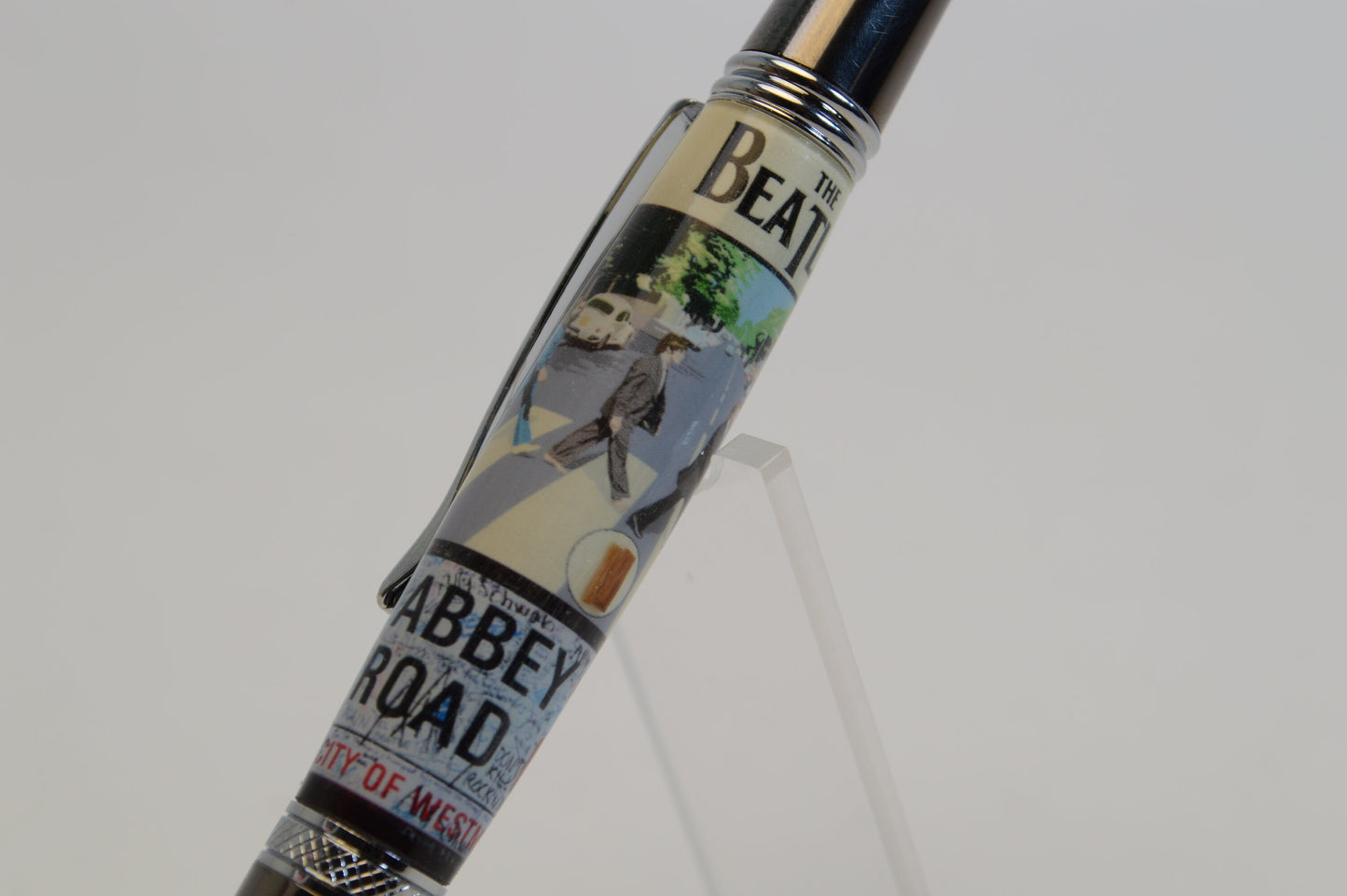 Handcrafted Pen Made with A Small Piece of Wood from Abbey Road Studios and cast in acrylic.