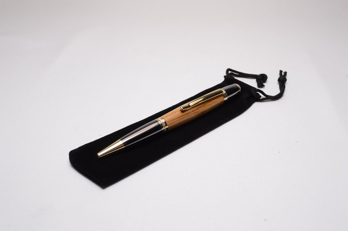 Whiskey Barrel Twist Pen in Gold and Black Titanium Finish with Velvet Pouch.