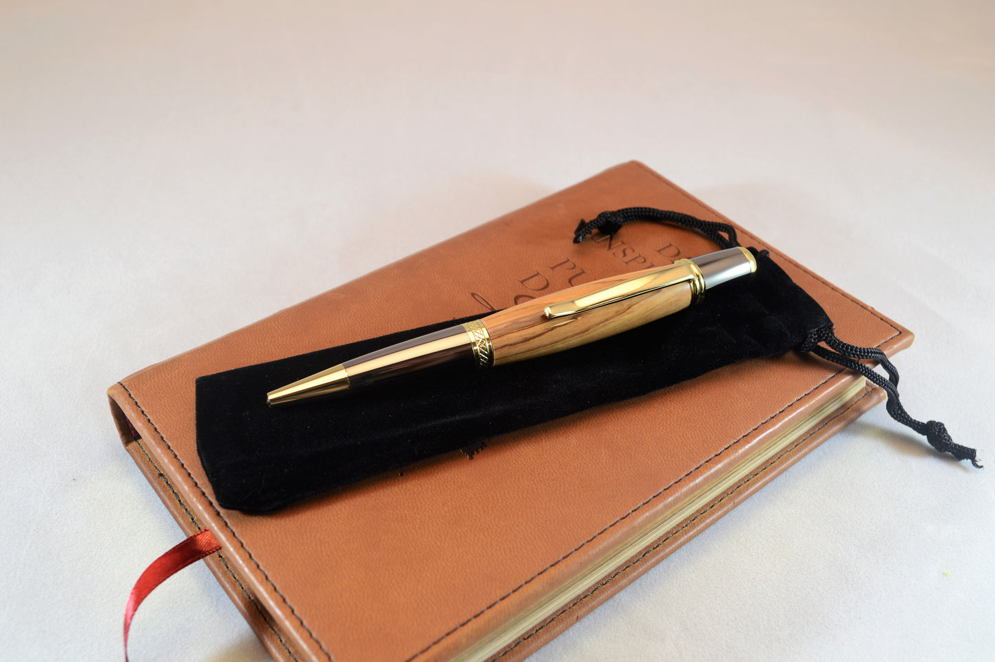 Handcrafted Bethlehem Olivewood Twist Pen in Gold Titanium and Black Titanium Finish