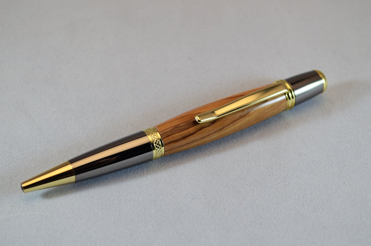 Handcrafted Bethlehem Olivewood Twist Pen in Gold Titanium and Black Titanium Finish