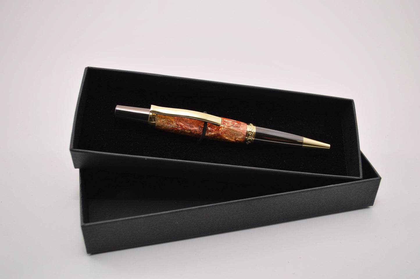 Elegant Gold and Gunmetal Twist Pen with Copper And Gold Gilding Cast in Clear Acrylic