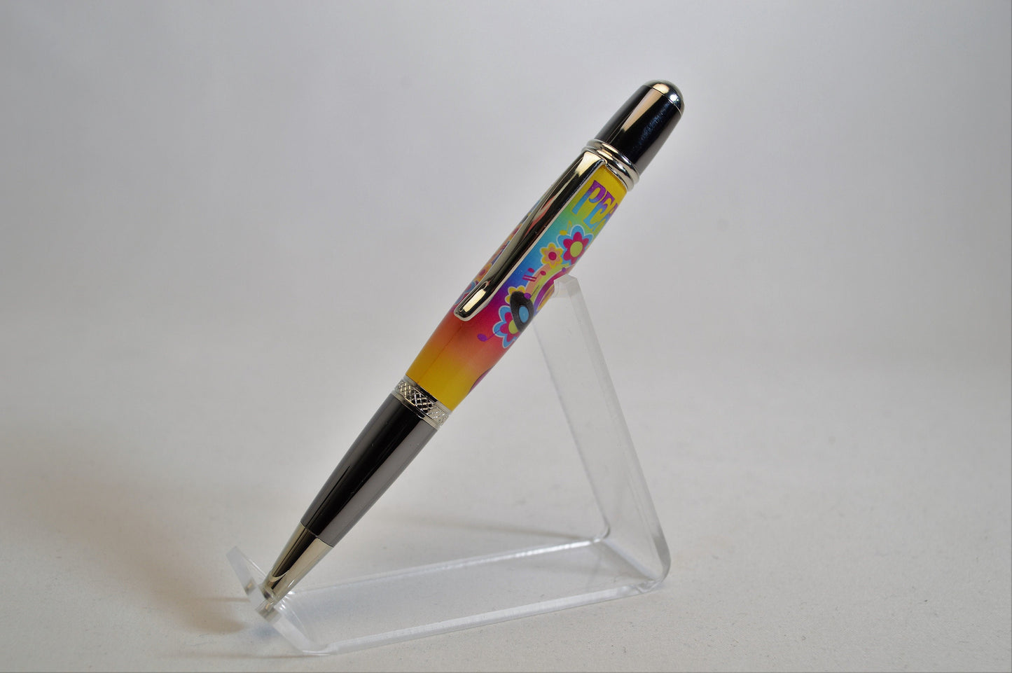 Handcrafted Pen Featuring a Small Piece of Woodstock Stage Wood and Cast in Acrylic.