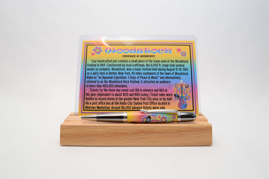 Handcrafted Pen Featuring a Small Piece of Woodstock Stage Wood and Cast in Acrylic.