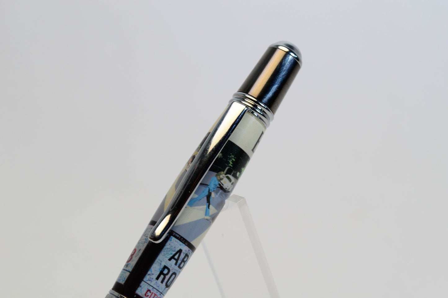 Handcrafted Pen Made with A Small Piece of Wood from Abbey Road Studios and cast in acrylic.