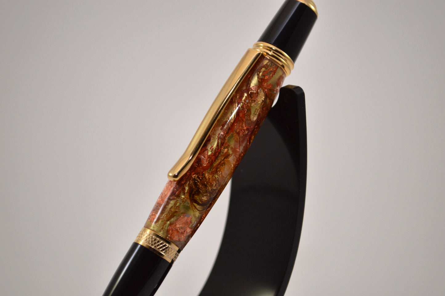 Elegant Gold and Black Chrome Twist Pen with Copper And Gold Gilding Cast in Clear Acrylic