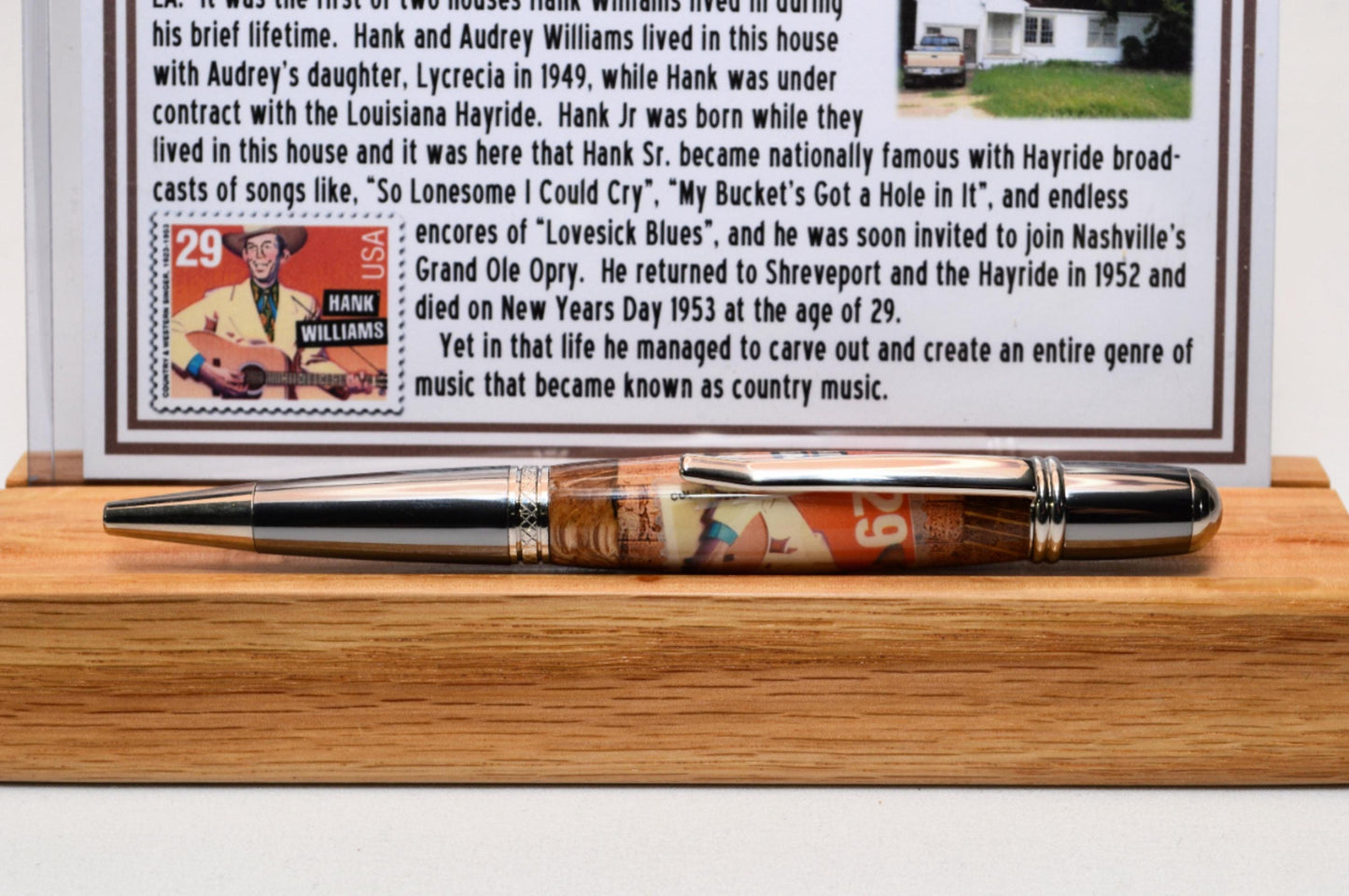 Handcrafted Pen Featuring a Hank Williams Postage Stamp and Wood from Hank Williams Bosier City, LA home cast in acrylic.