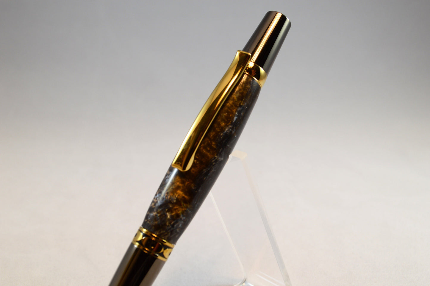 One of a Kind Twist Pen in Gold Titanium and Black Titanium with Handcrafted Acrylic Body.