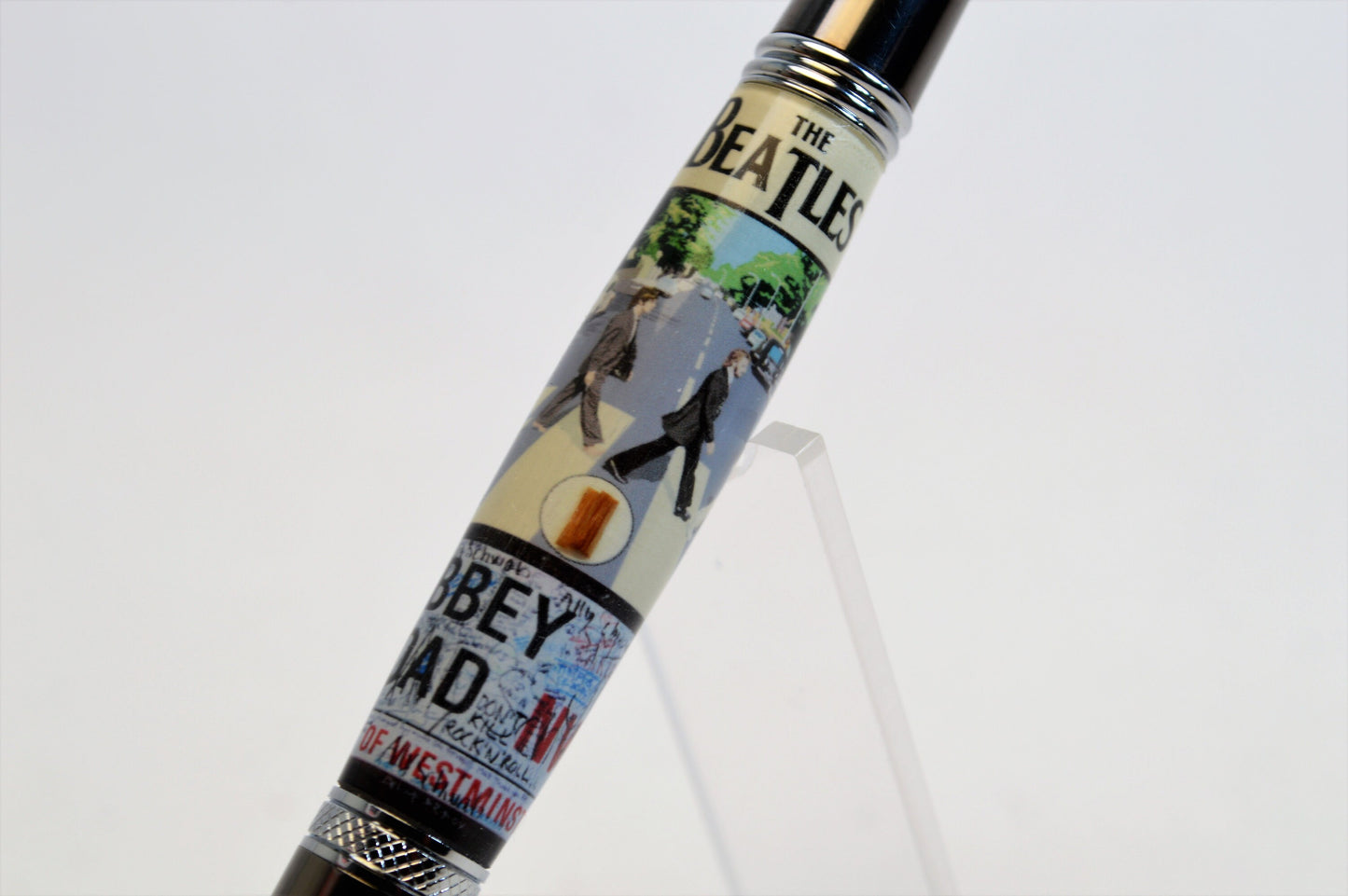Handcrafted Pen Made with A Small Piece of Wood from Abbey Road Studios and cast in acrylic.