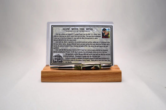 Handcrafted Pen Featuring Gone With The Wind Postage Stamp and Small Piece of Wood From Margaret Mitchell's apartment and cast in acrylic.