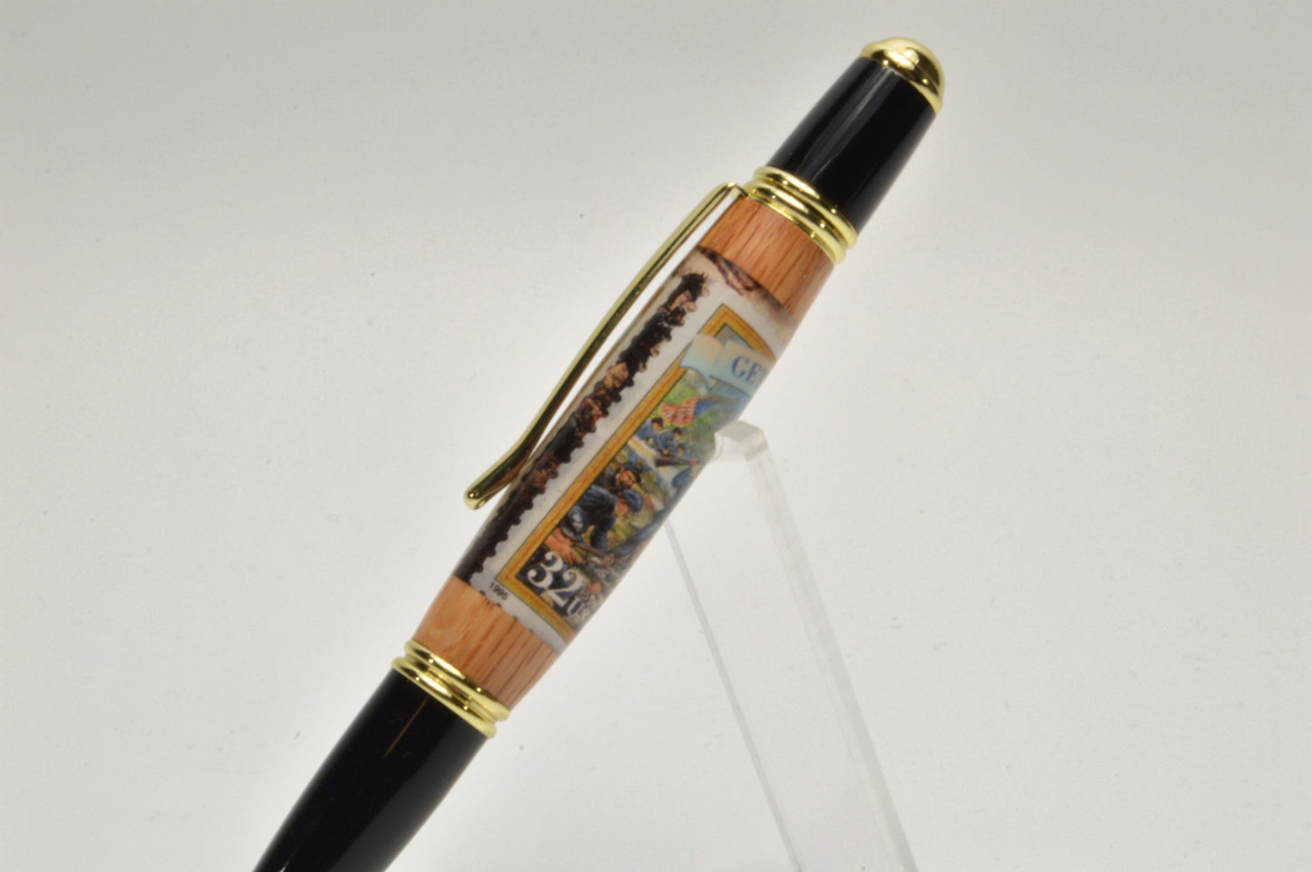 Handcrafted Gettysburg Twist Pen Made With a US Stamp Depicting The Battle of Gettysburg and Witness Wood in Gold and Black Chrome Finish