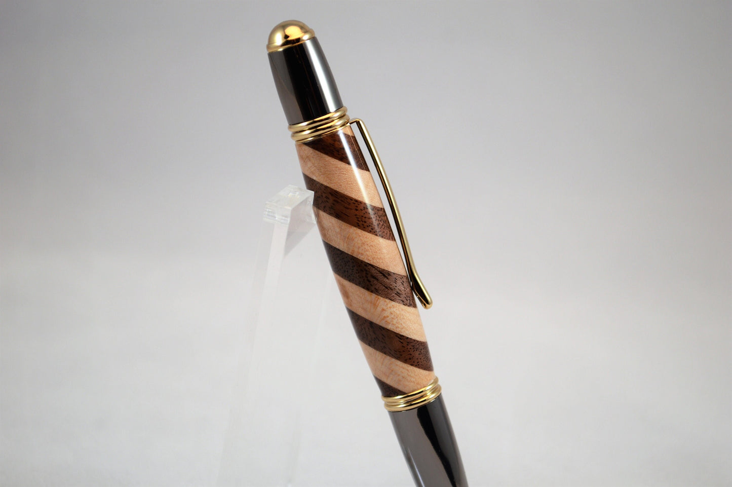 One of a Kind Classic Twist Pen in 22k Gold and Gunmetal Finish with Handcrafted Maple and Walnut.