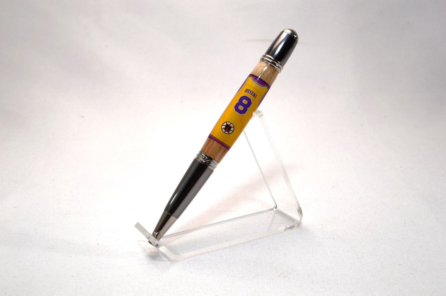 Handcrafted Pen Made With A Piece of A Game Used Basketball Used by Kobe Bryant and Wood From The LA Lakers' Forum Stadium Seat