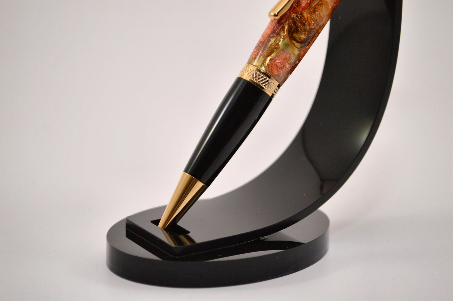 Elegant Gold and Black Chrome Twist Pen with Copper And Gold Gilding Cast in Clear Acrylic